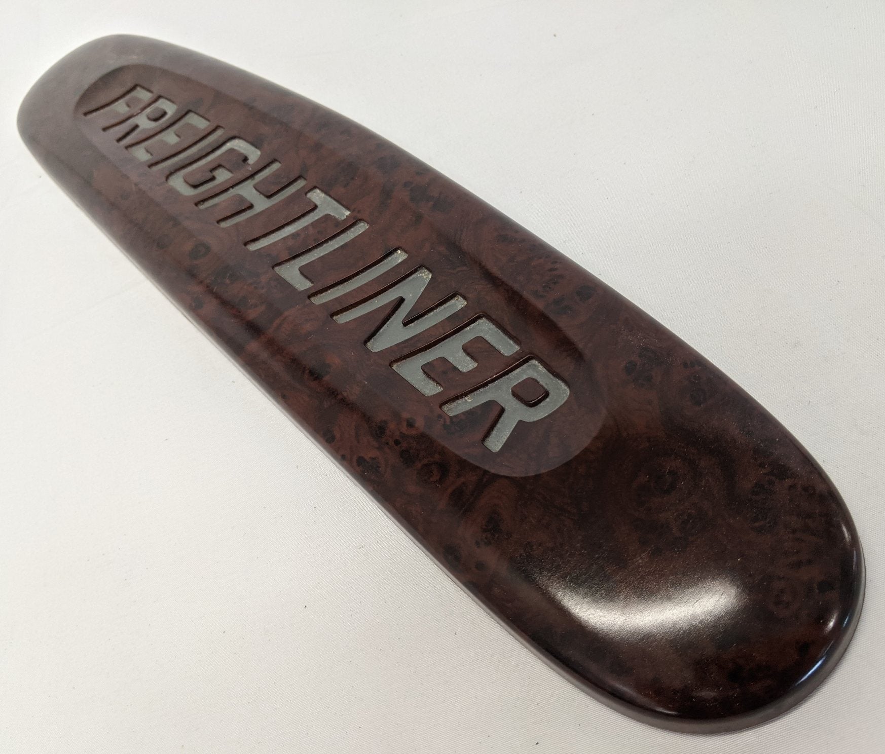 Damaged Freightliner Woodgrain Nameplate Badge - P/N 18-31915-000 (10032741744956)