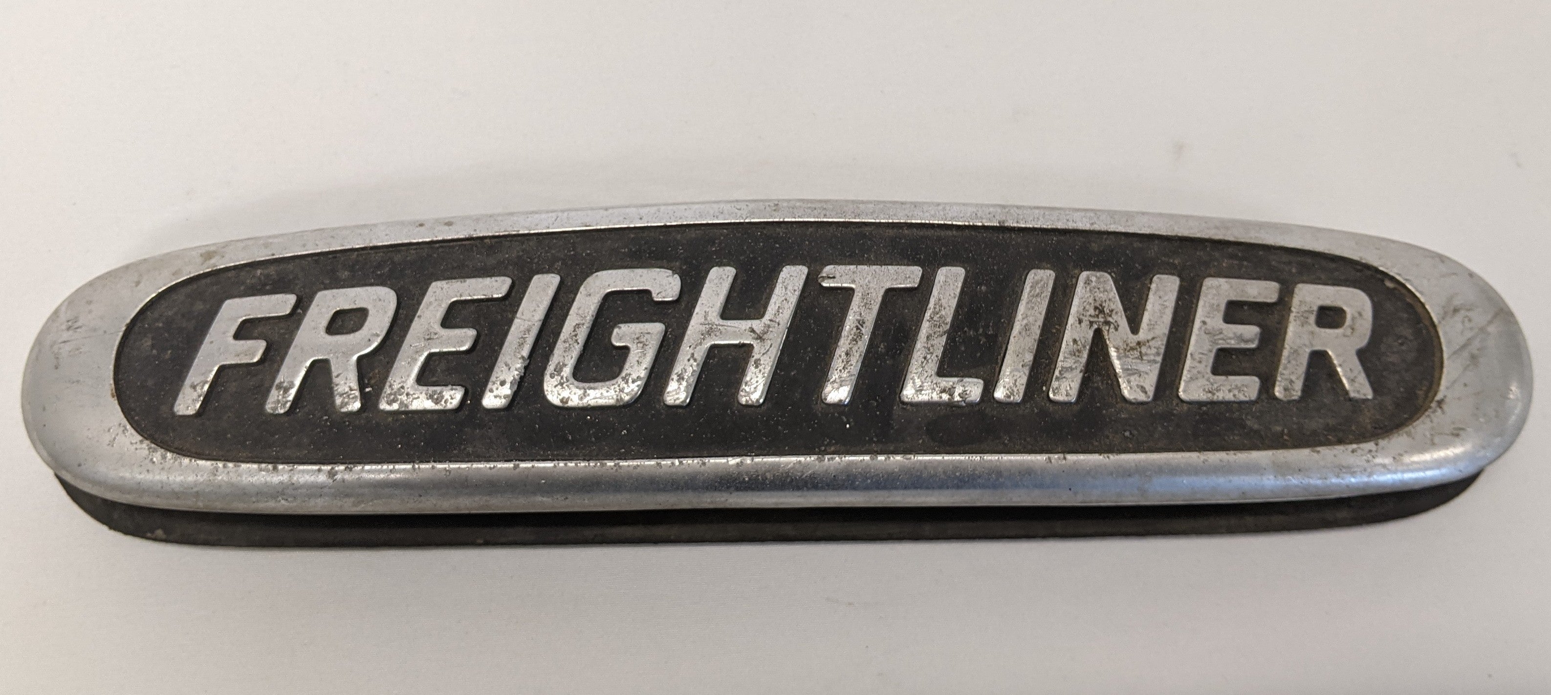 Used Freightliner 10 1/4" x 2 1/4" Aluminum Nameplate Emblem- P/N 22-45504-000 (10016230408508)