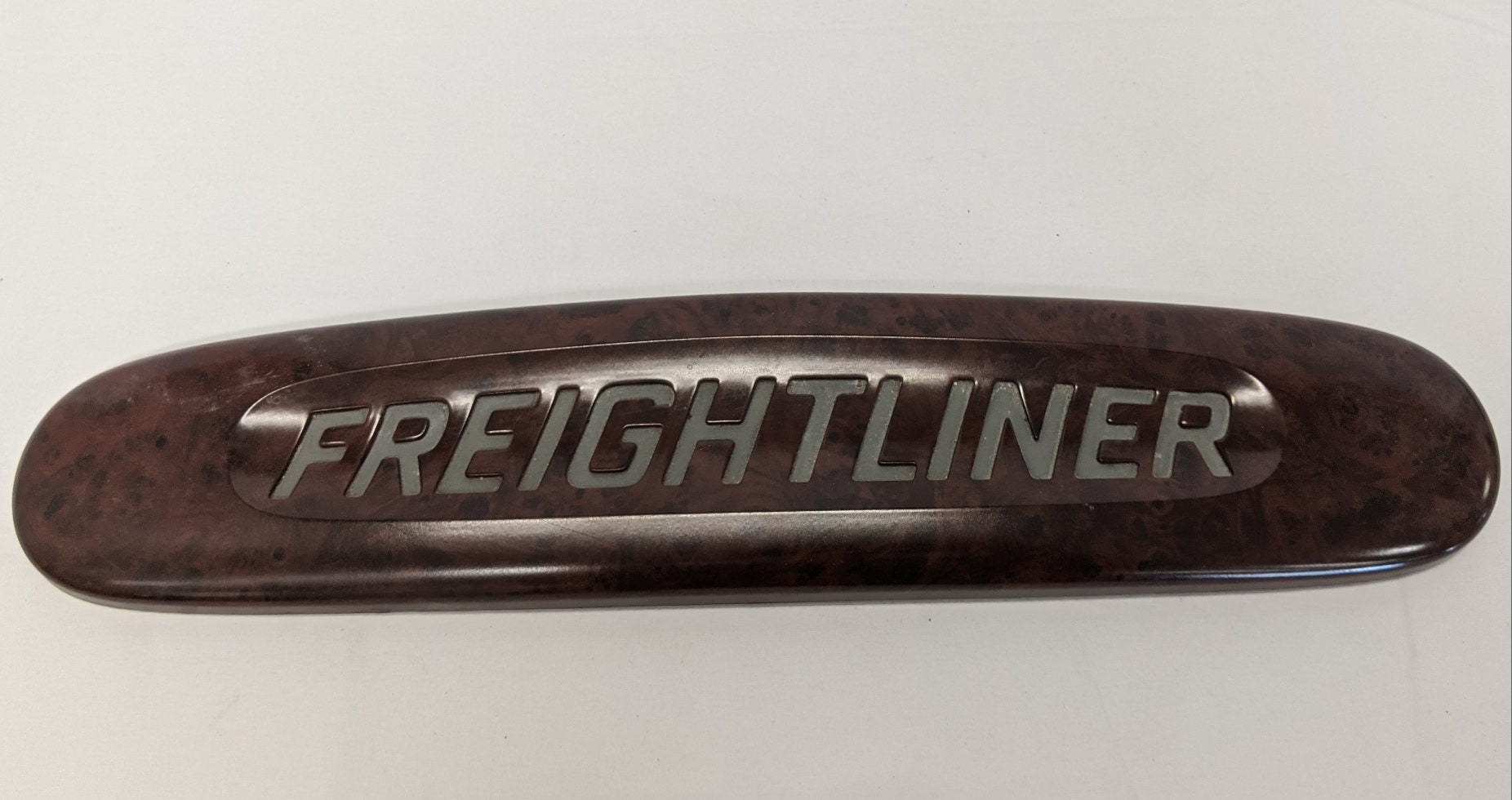 Damaged Freightliner Woodgrain Nameplate Badge - P/N 18-31915-000 (10032741744956)