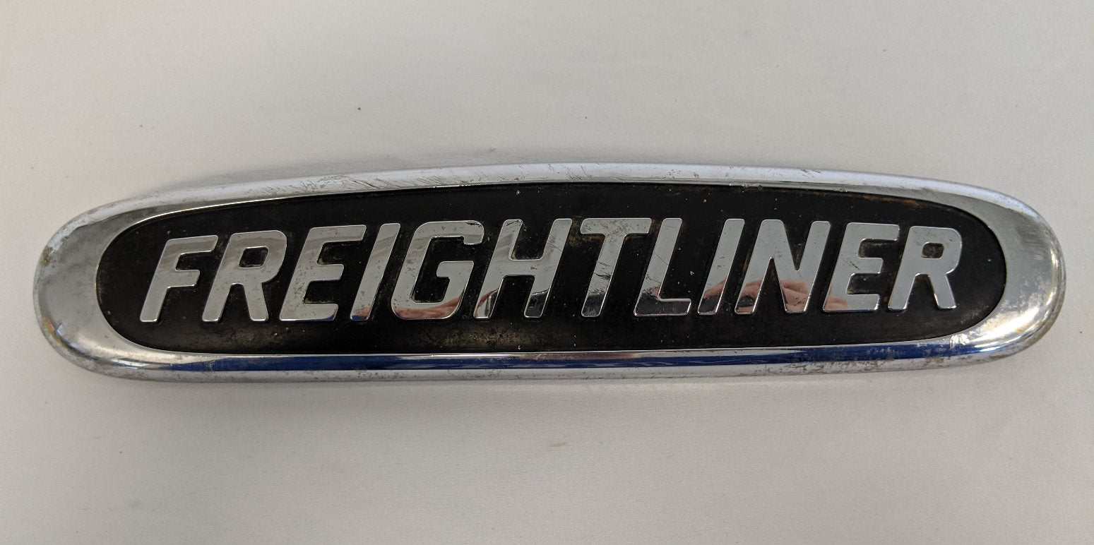 Damaged Freightliner Plastic Semi Truck Emblem - Broken Studs - P/N 22-57546-000 (4508029255766)