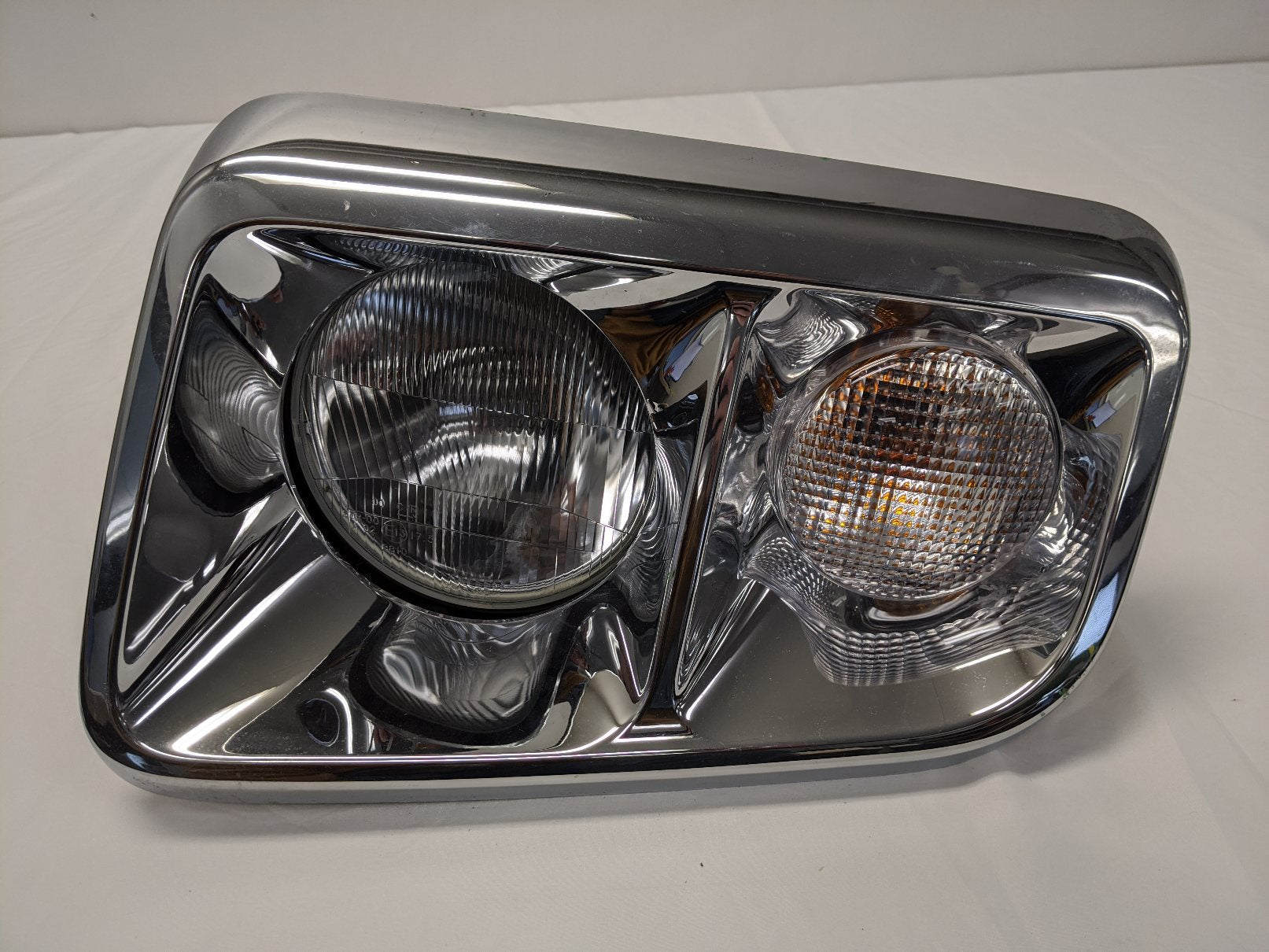 Damaged Freightliner Coronado SD122 LH Chrome Head Light - P/N A06-88646-000