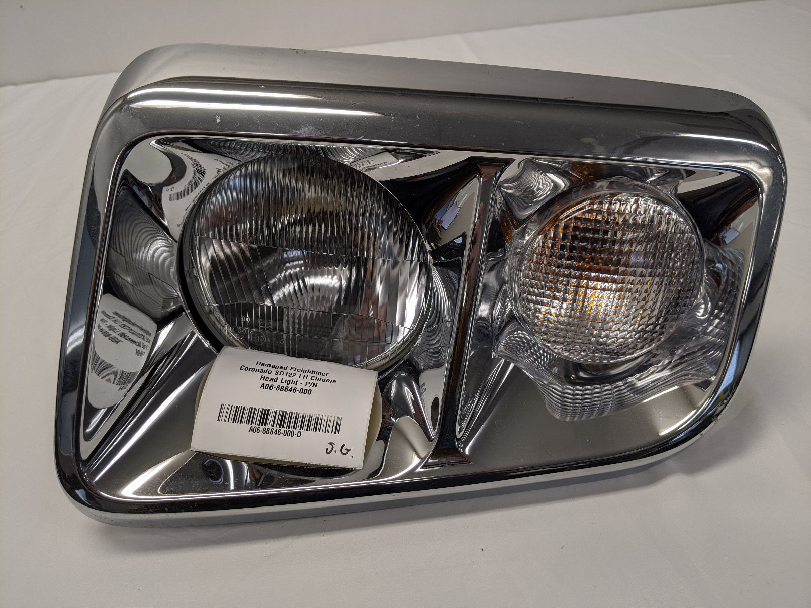 Damaged Freightliner Coronado SD122 LH Chrome Head Light - P/N A06-88646-000