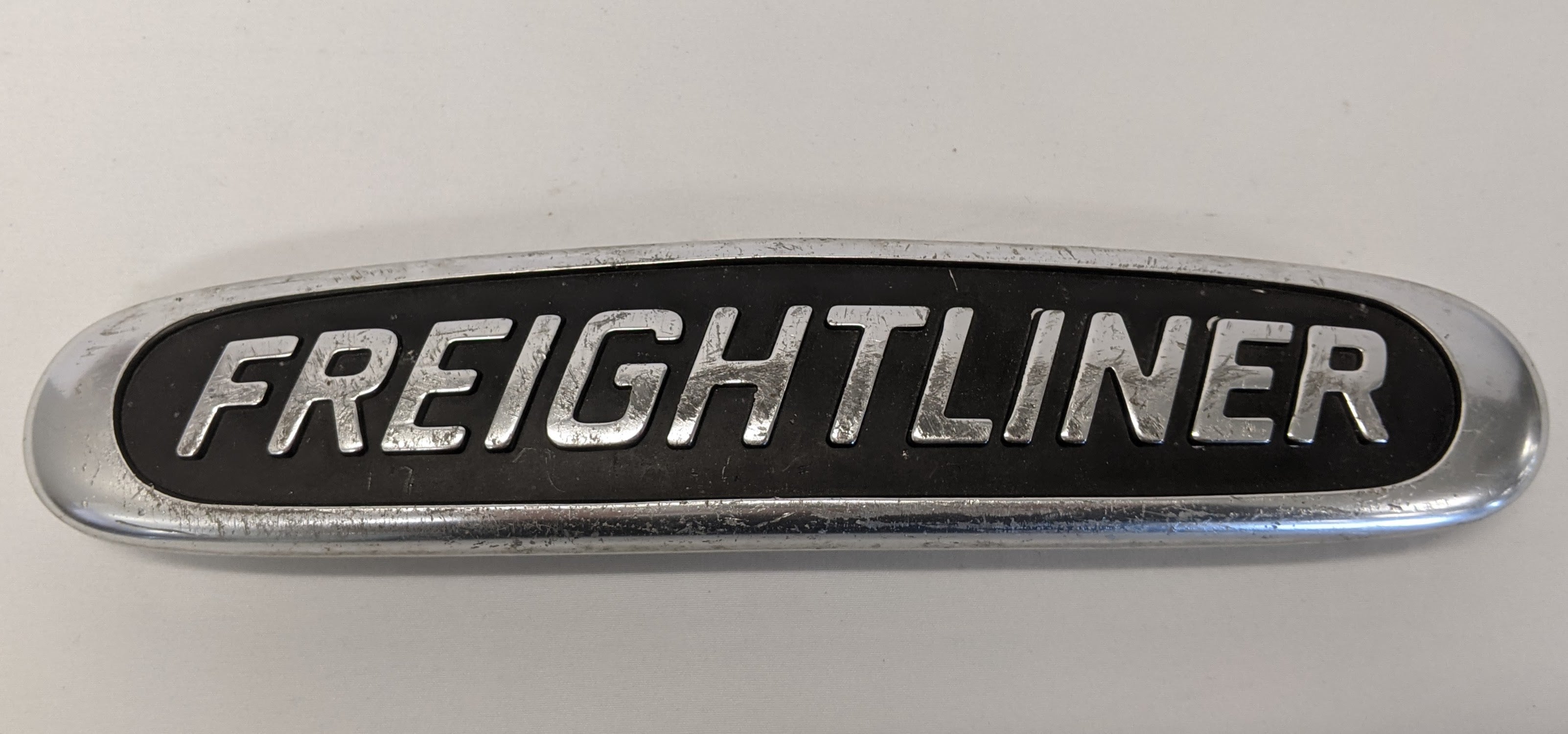 Used Freightliner 10 1/4" x 2 1/4" Aluminum Nameplate Emblem -P/N  22-45504-000 (10016233128252)