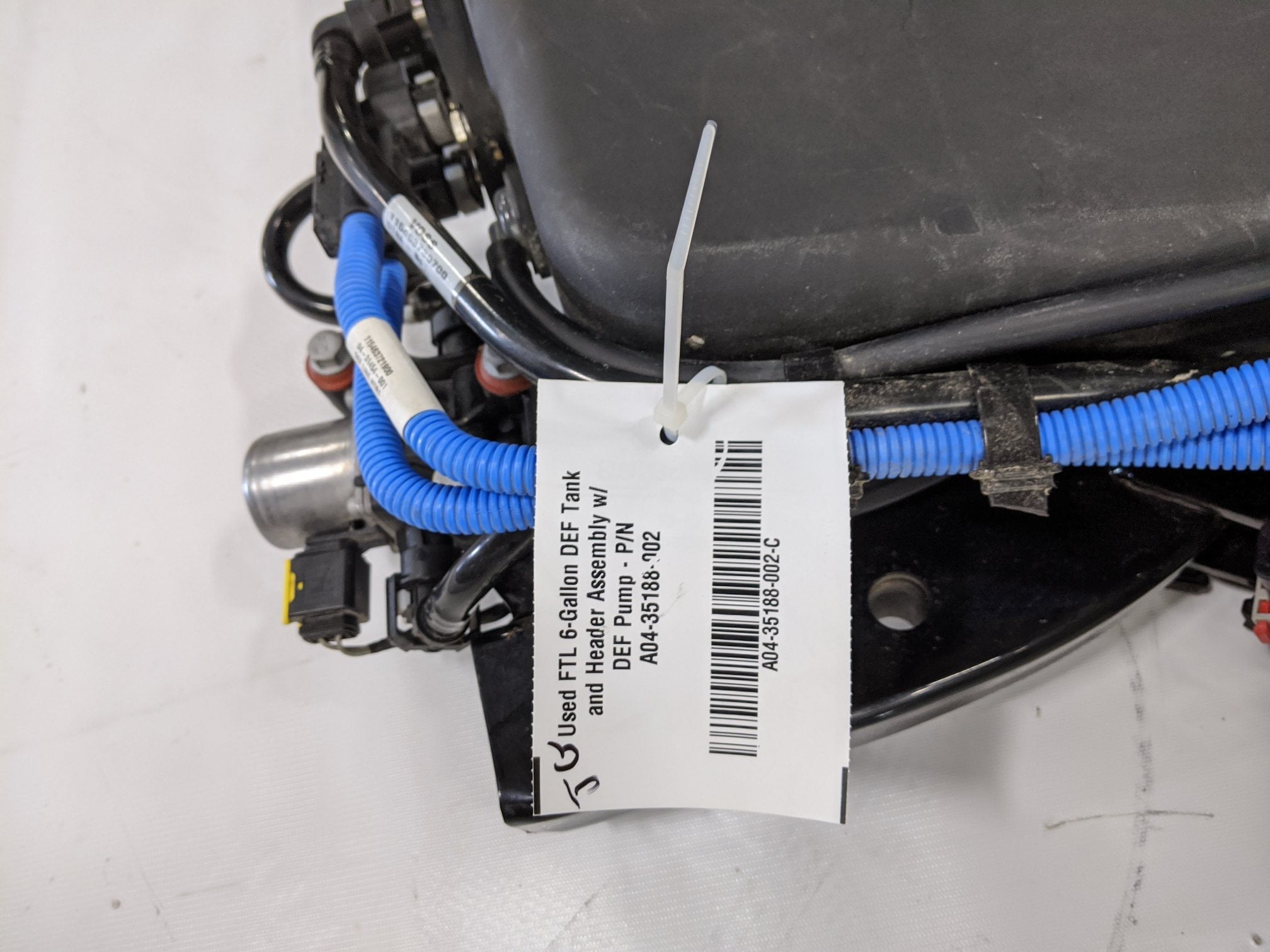 Used FTL 6-Gallon DEF Tank and Header Assembly w/ DEF Pump - P/N A04-35188-002 (10114262270268)