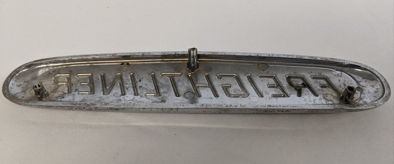 Damaged Freightliner Plastic Semi Truck Emblem - Broken Studs - P/N  22-57546-000 (4508029255766)