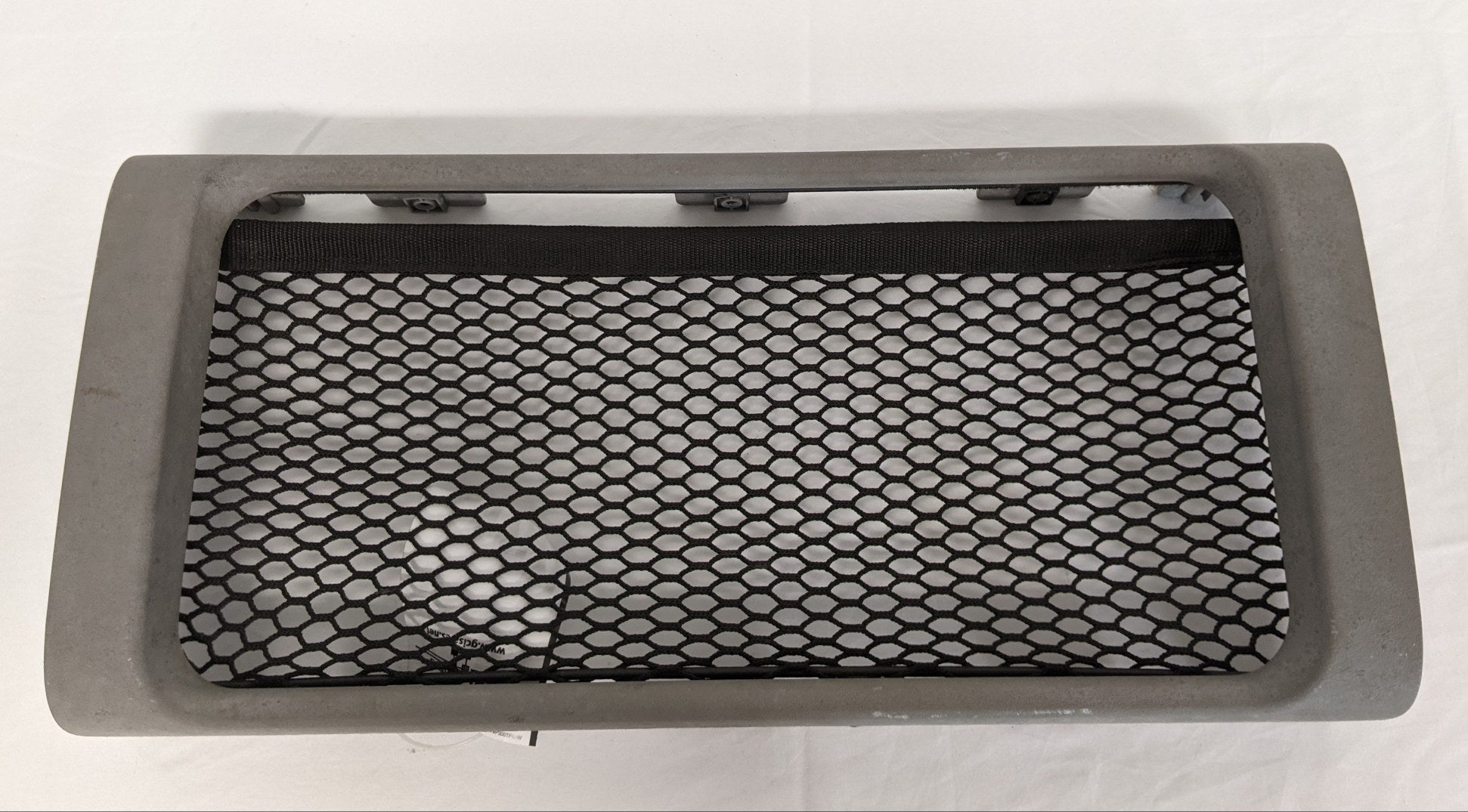 Used Freightliner Columbia Storage Cabinet Fascia w/ Netting - P/N A18-33389-007 (9746269602108)