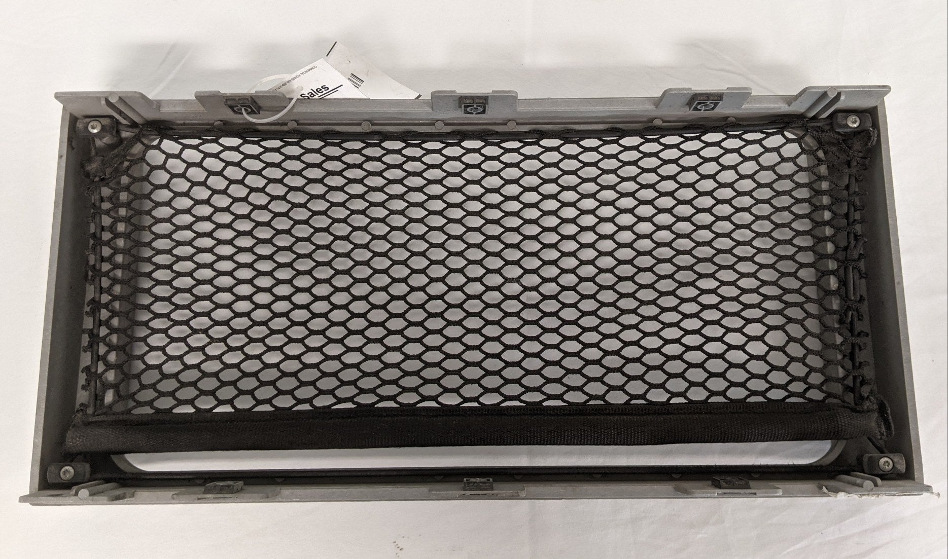 Used Freightliner Columbia Storage Cabinet Fascia w/ Netting - P/N A18-33389-007 (9746269602108)